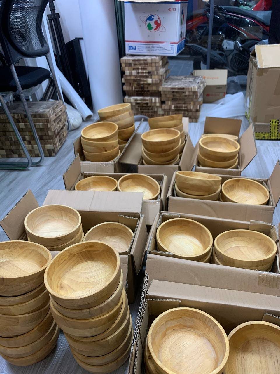 Turned wooden bowls packed in cartons